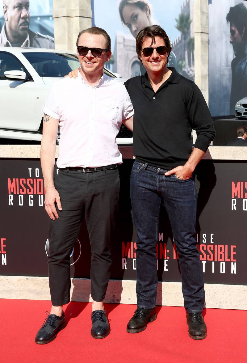 VIENNA, AUSTRIA - JULY 23:  (EDITORS NOTE: This image has been digitally manipulated) Actors Simon Pegg and Tom Cruise arrive for the world premiere of 'Mission: Impossible - Rogue Nation' at the Opera House (Wiener Staatsoper) on July 23, 2015 in Vienna, Austria.  (Photo by Andreas Rentz/Getty Images for Paramount Pictures International)