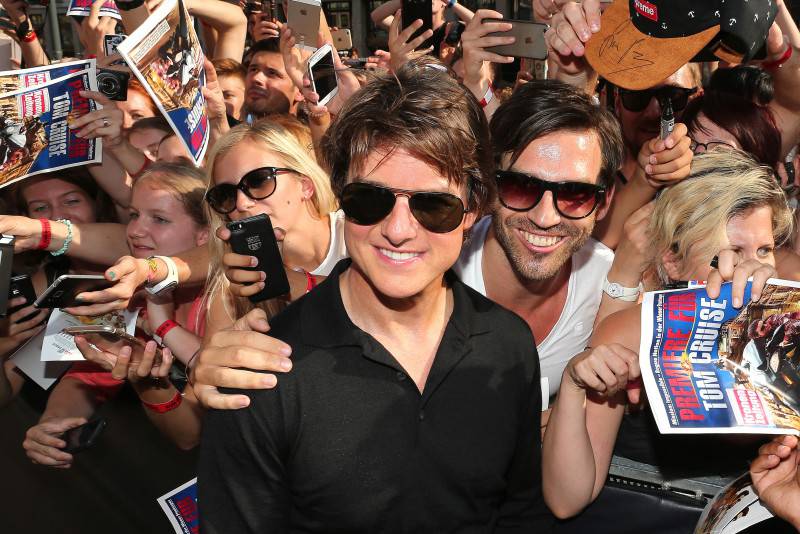 VIENNA, AUSTRIA - JULY 23:  (EDITORS NOTE: This image has been digitally manipulated) Tom Cruise poses with fans during the world premiere of 'Mission: Impossible - Rogue Nation' at the Opera House (Wiener Staatsoper) on July 23, 2015 in Vienna, Austria.  (Photo by Gisela Schober/Getty Images for Paramount Pictures International)
