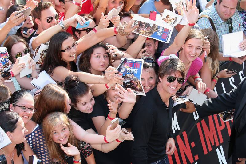 VIENNA, AUSTRIA - JULY 23:  Tom Cruise poses with fans during the world premiere of 'Mission: Impossible - Rogue Nation' at the Opera House (Wiener Staatsoper) on July 23, 2015 in Vienna, Austria.  (Photo by Gisela Schober/Getty Images for Paramount Pictures International)